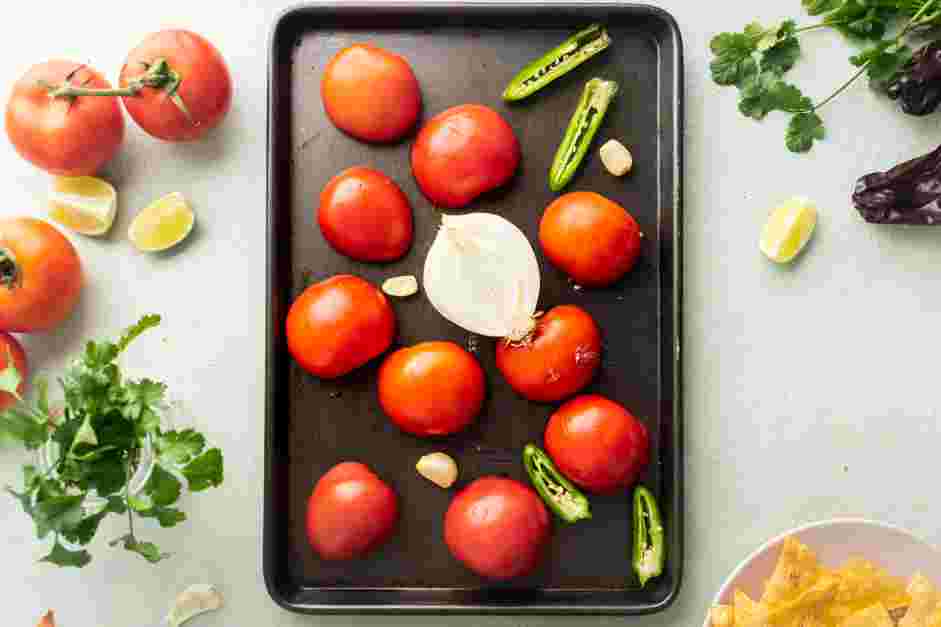 Salsa Roja Recipe:
On a sheet pan, transfer the tomatoes, jalapeño peppers, onions and garlic cloves to a sheet pan with the skins facing up.