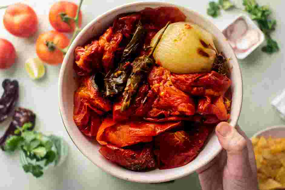 Salsa Roja Recipe: Transfer the roasted vegetables to the jar of a blender.