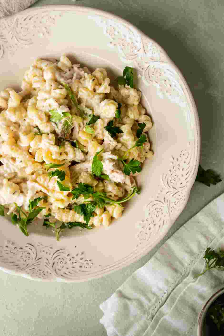 Crockpot Chicken Alfredo Recipe: Garnish with fresh parsley before serving.