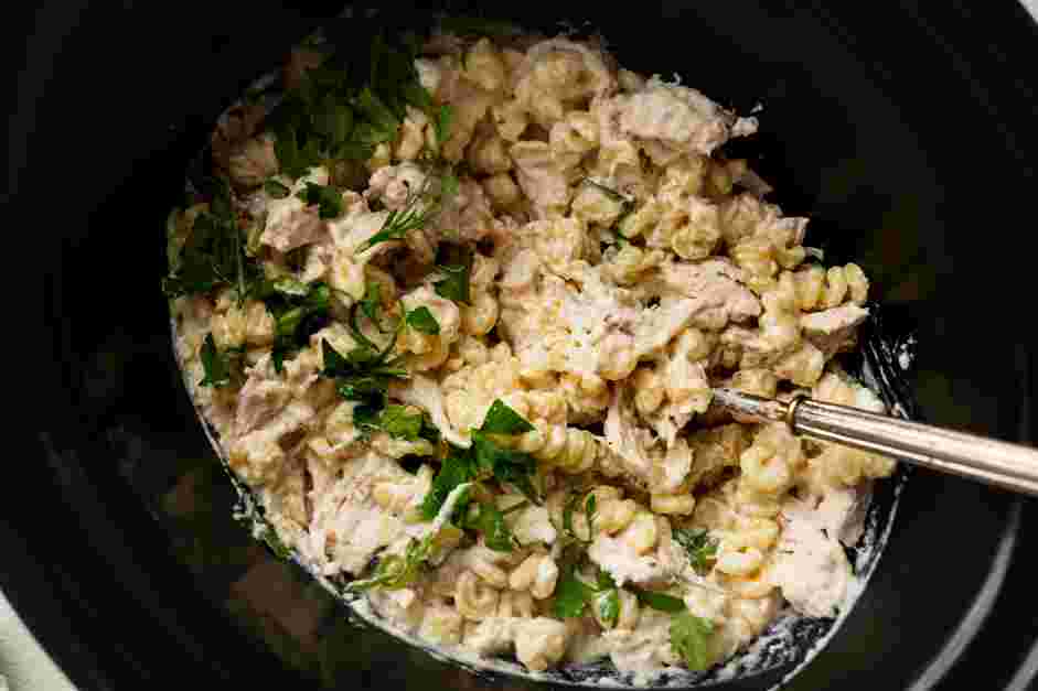 Crockpot Chicken Alfredo Recipe: 
Once the pasta is cooked, stir in the Parmesan cheese and the chicken.