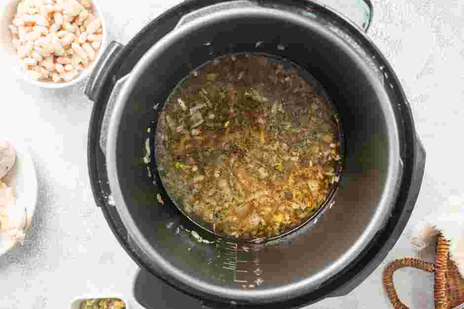 Instant Pot White Chicken Chili Recipe:
Add the chicken broth and scrape up any browned bits on the bottom of the pot.