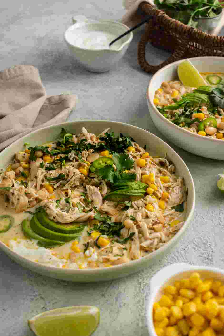 Instant Pot White Chicken Chili Recipe: Top the bowl of the white chicken chili with diced avocado and fresh cilantro.