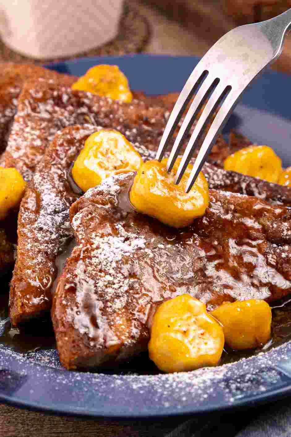 Bananas Foster French Toast Recipe: 
Use a large spoon to place some of the soaked banana slices onto the French toast and then spoon the sauce over top.