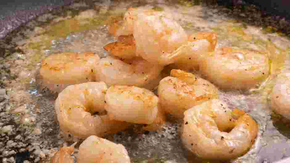 Creamy Shrimp Pasta Recipe:
Transfer the shrimp to the saute pan that has the reduction of wine and lemon.