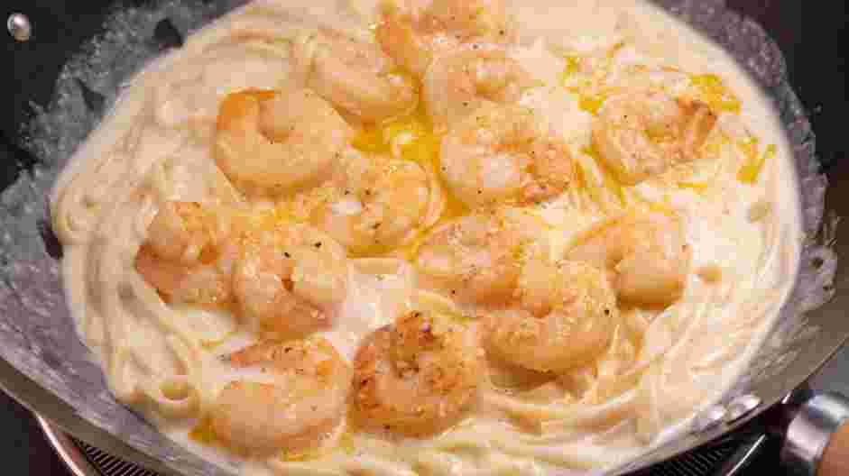 Creamy Shrimp Pasta Recipe:
Transfer the shrimp and the wine reduction into the pan.