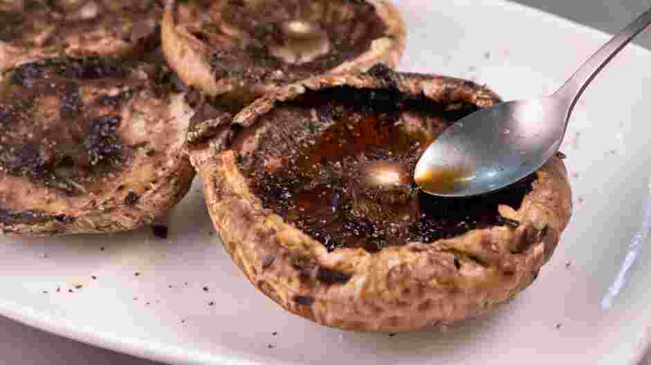 Portobello Mushroom Sandwich Recipe: Place the mushrooms bottom side up and drizzle the balsamic vinegar on top.