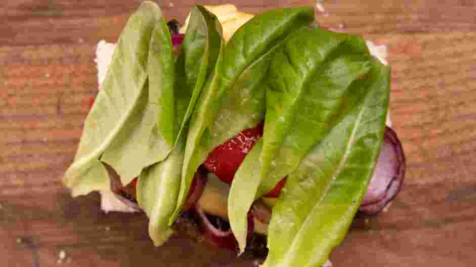 Portobello Mushroom Sandwich Recipe: Top with mushroom and cheese, roasted pepper, onion and lettuce.