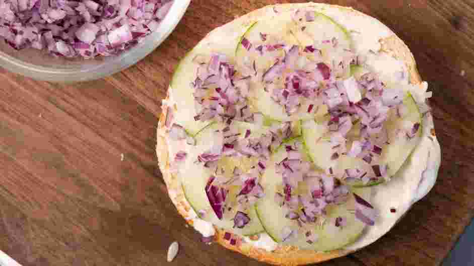 Smoked Salmon Bagel Recipe: Layer the sliced cucumber and onion (or scallions).