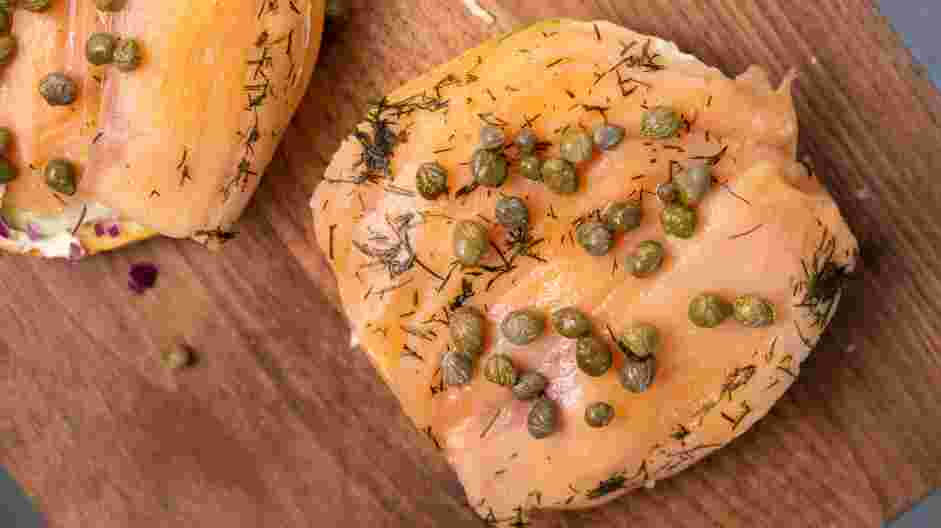 Smoked Salmon Bagel Recipe: Place the salmon on top and sprinkle on the capers.