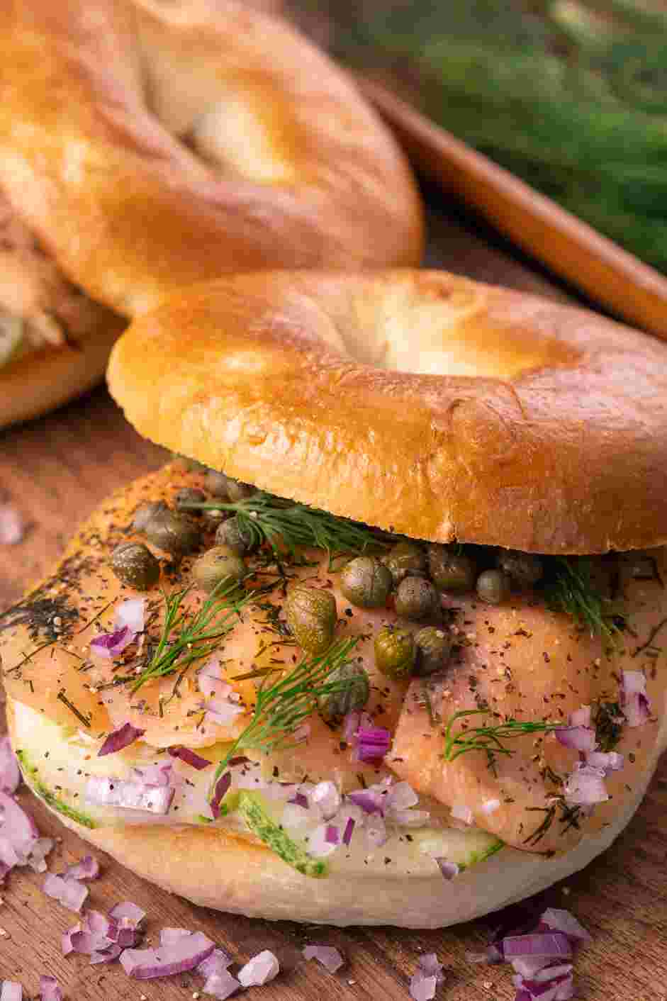 Smoked Salmon Bagel Recipe:
Grate the black pepper over the salmon and add the dill cut in half.