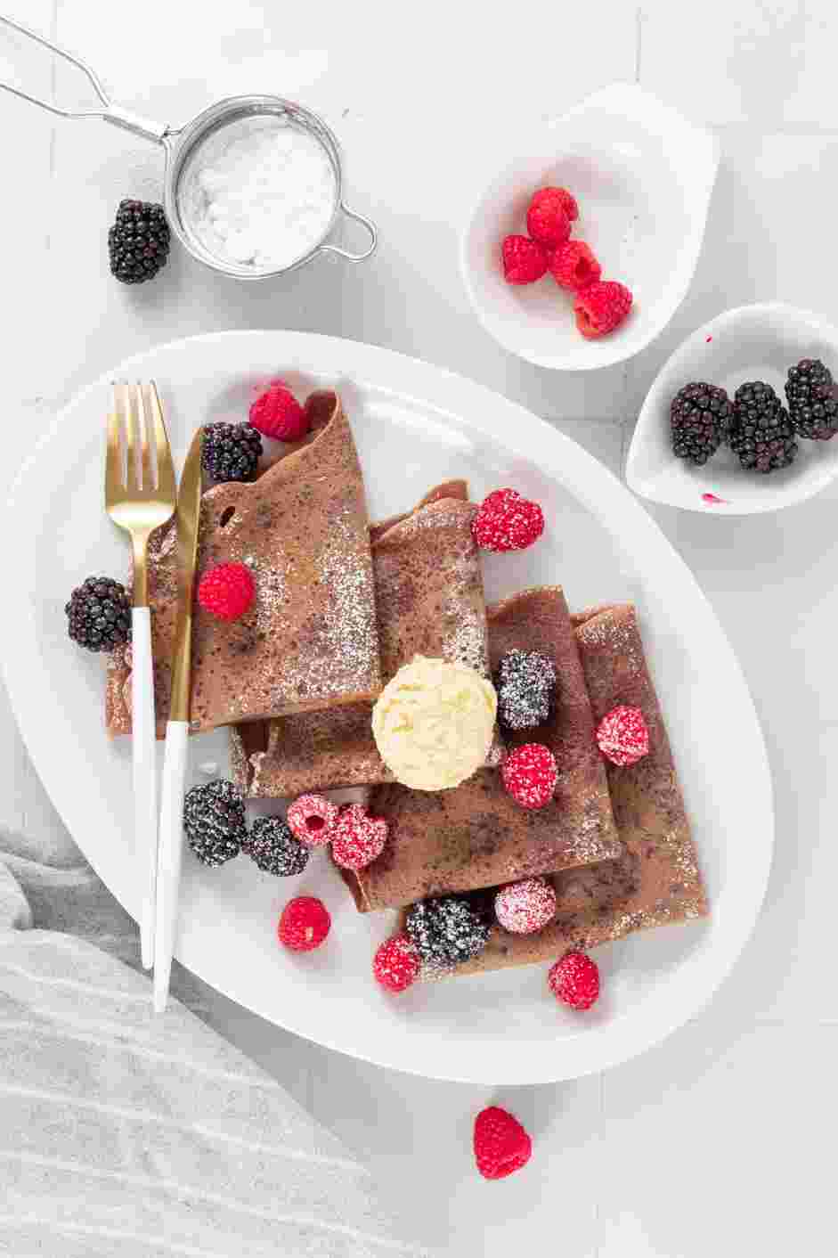 Chocolate Crepes Recipe:
Serve plain, dusted with confectioners’ sugar or filled with fresh fruit or vanilla ice cream.
