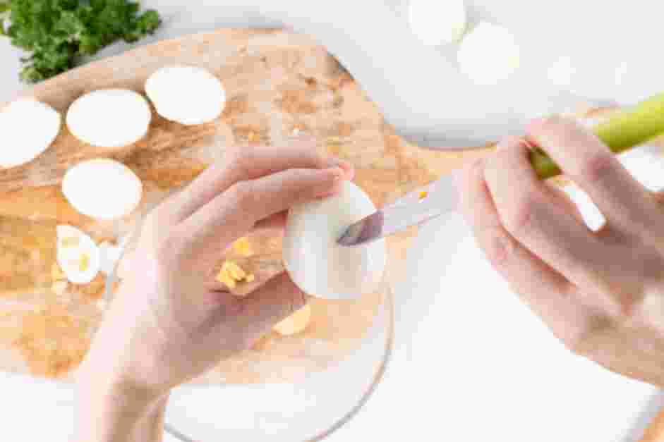 Deviled Egg Chicks Recipe:
Next, horizontally slice the pointy top third of the egg using a zig-zag pattern.