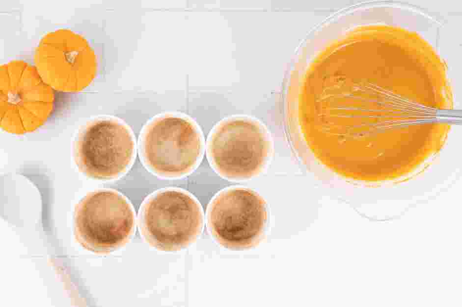 Pumpkin Custard Recipe:
Coat the inside of the ramekins with the cinnamon sugar by pouring the mixture into one ramekin and swirling to coat.