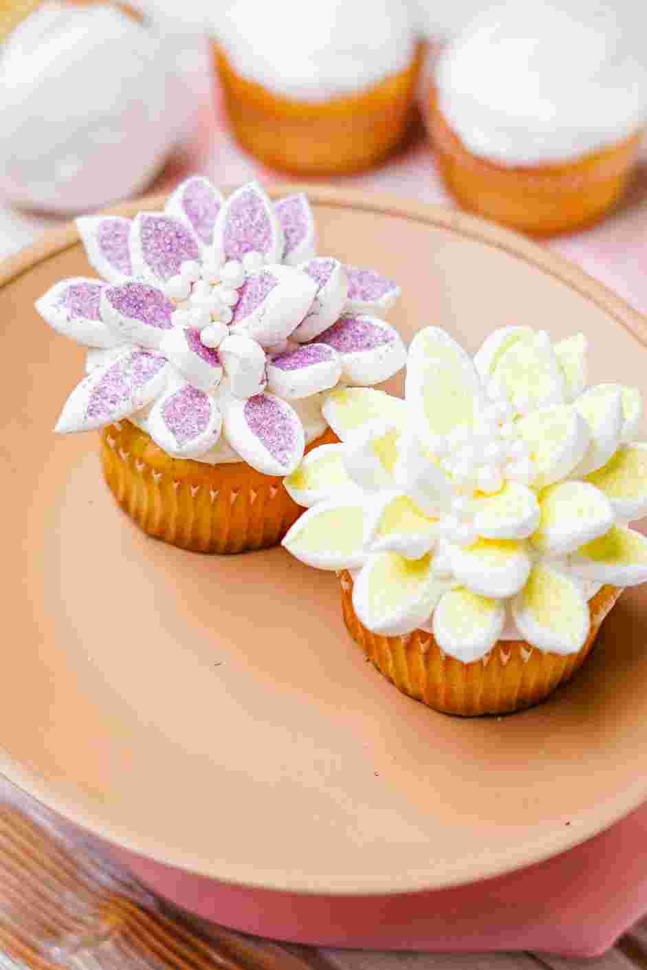 Flower Cupcakes Recipe: 
Sprinkle the nonpareils in the center of the flower cupcake for the pistil.