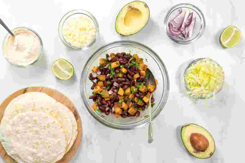 Butternut Squash Tacos Recipe:
Once the butternut squash is cooked, add it to the bean mixture and toss to coat.