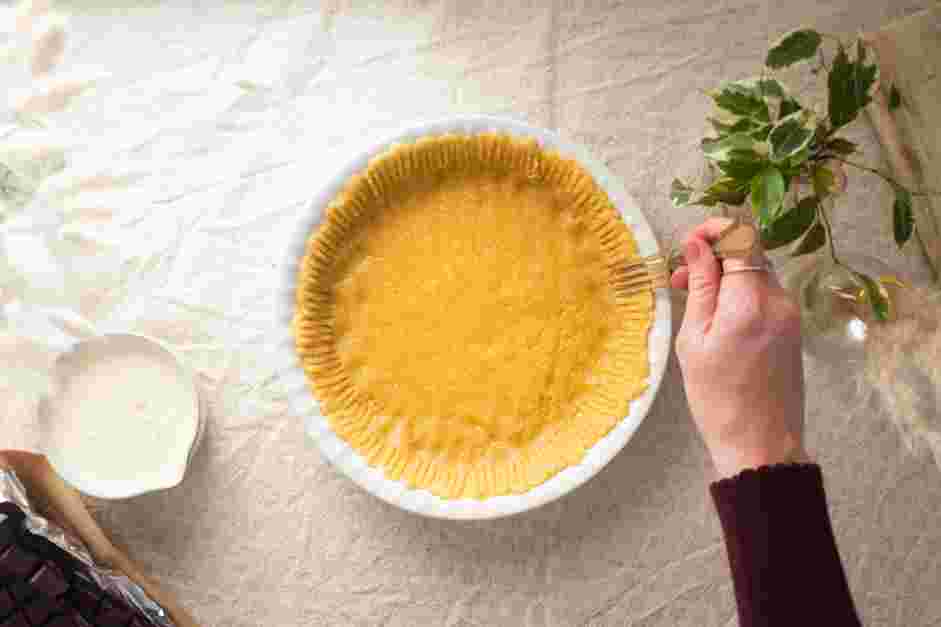 Chocolate Ganache Tart Recipe: Pierce several holes of the bottom crust with a fork.