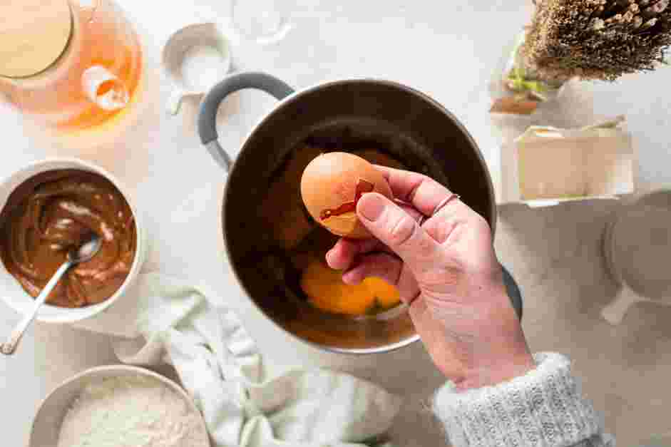 Dulce de Leche Cookies Recipe: Take the saucepan off of the heat and stir in the brown sugar and eggs.