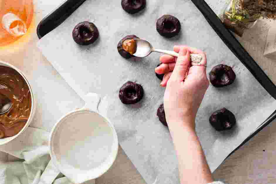 Dulce de Leche Cookies Recipe: Use a damp finger to create a large indentation in the center of the dough.