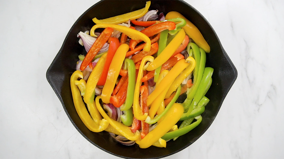 Vegetarian Fajitas Recipe:
In a large skillet over medium heat, add the olive oil, red onions, red, yellow and green peppers, chili powder, smoked paprika, garlic powder, cumin, salt and pepper.