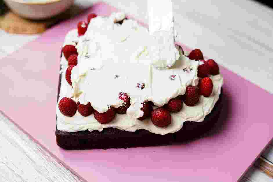 Heart Shape Cake Recipe: 
Layer the second layer of whipped mascarpone cream on top of the raspberries until smooth.