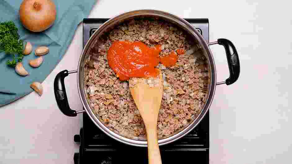 Rigatoni Bolognese Recipe: Add the tomato paste and cook stirring constantly until the tomato paste turns slightly darker in color, about 1-2 minutes.