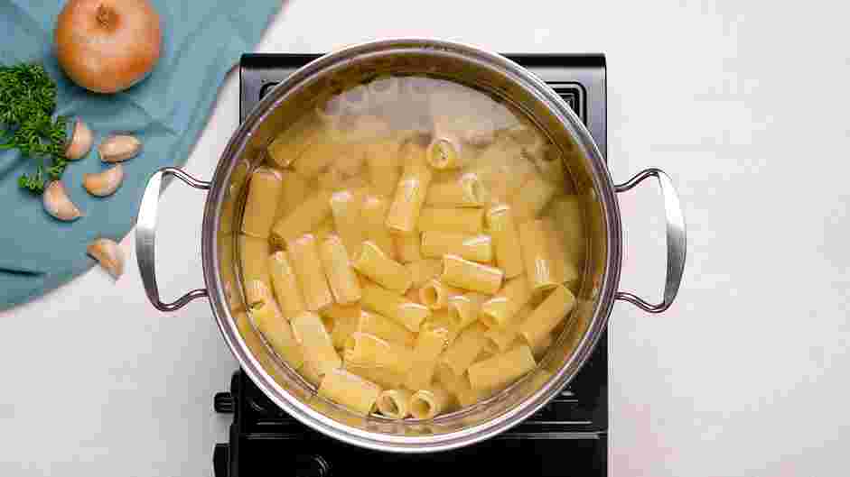 Rigatoni Bolognese Recipe: While the sauce is simmering, bring a large pot of salted water to a boil.