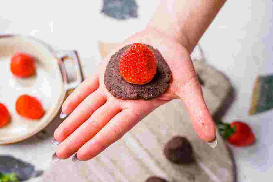 Strawberry Mochi Recipe:
Flatten one ball of the red bean paste in your palm.