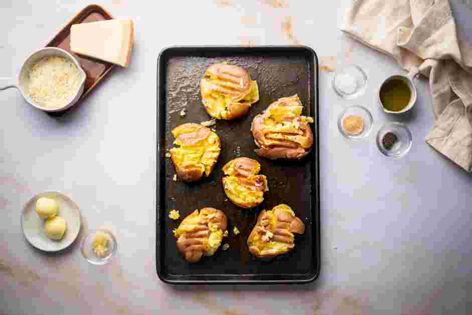 Smashed Red Potatoes Recipe: Using either a fork or a potato masher, smash the potatoes until flattened.