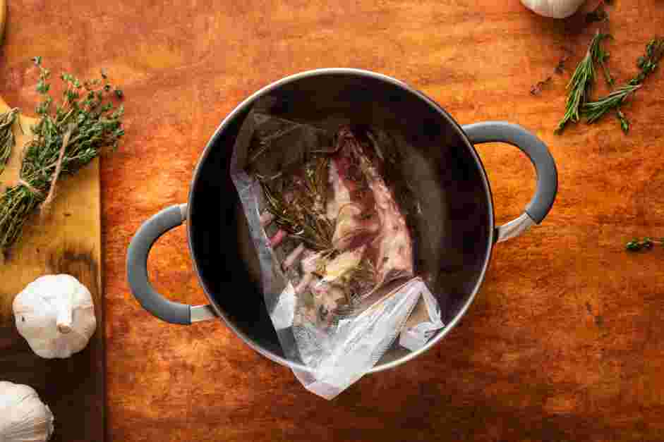 Sous Vide Lamb Chops Recipe: Submerge the vacuum-sealed rack of lamb into the sous vide water bath.