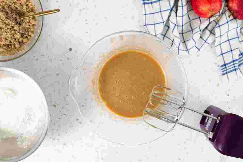 Apple Crumble Cake Recipe:
With the mixer on low speed, slowly add the flour mixture to the oil mixture.