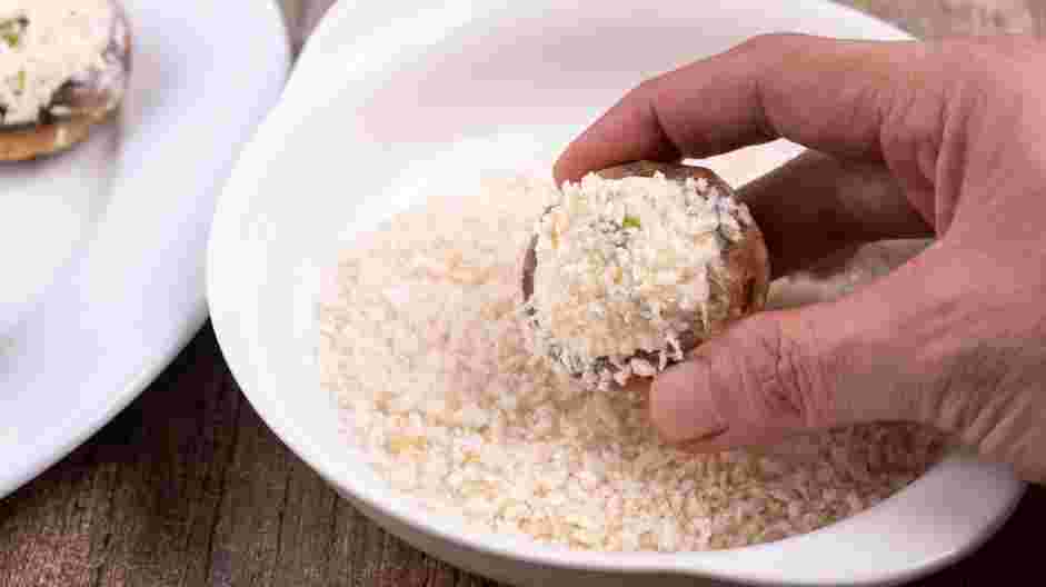 Cream Cheese Stuffed Mushrooms Recipe:
Dip the cream cheese topped mushroom into the panko to create a light crust on the cream cheese portion of the stuffed mushroom.