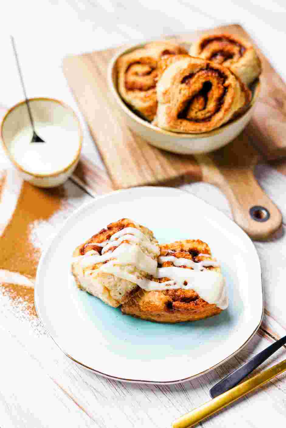 Gluten Free Cinnamon Rolls Recipe: Let the cinnamon rolls cool for at least 10 minutes before topping with