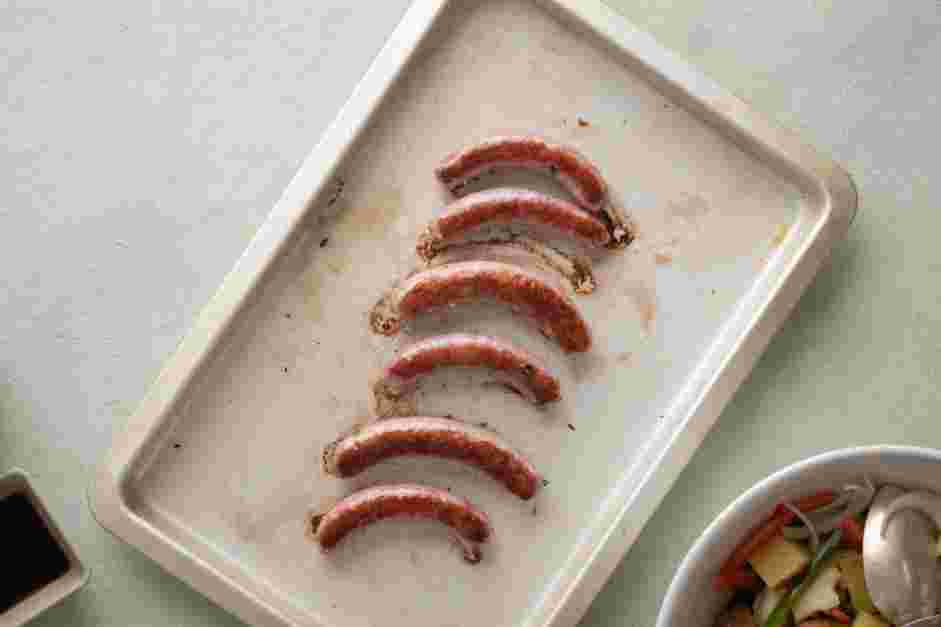 Sheet Pan Sausage and Veggies Recipe:
Transfer the sausage to a sheet pan and roast for 7 minutes.