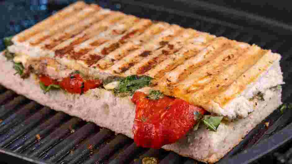 Chicken Pesto Sandwich Recipe: Use a panini press or a saute pan to heat both sides of the sandwich until the cheese slightly melts.