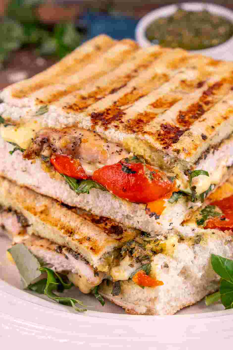 Chicken Pesto Sandwich Recipe: Slice the sandwich in half and serve.