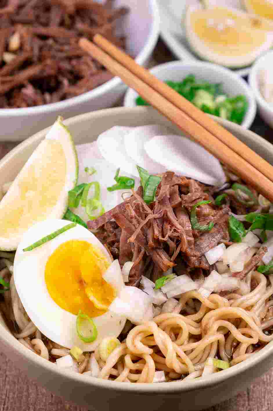 Birria Ramen Recipe: Top the birria ramen with finely diced white onion, thinly sliced radish and fresh cilantro or scallion.