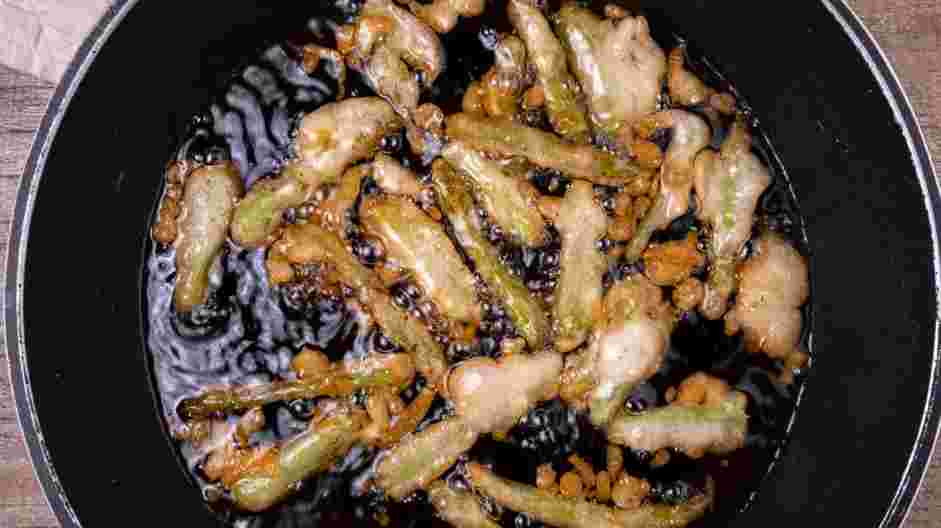 Salmon Poke Bowl Recipe: 
Lower the battered asparagus spears into the hot oil.