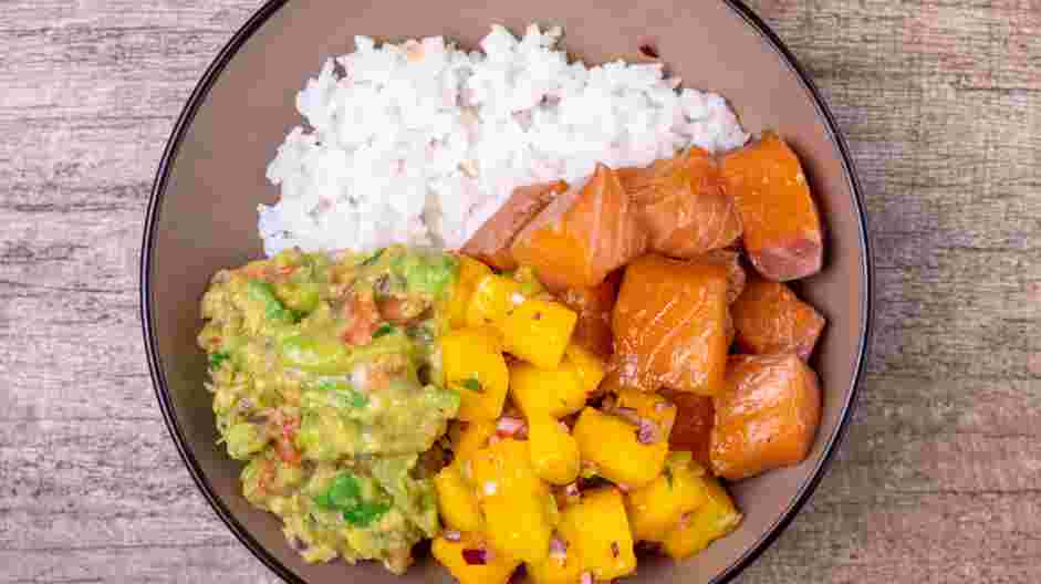 Salmon Poke Bowl Recipe:
Top each with a large scoop of the salmon poke, a small scoop of the mango salsa and a small scoop of the guacamole.