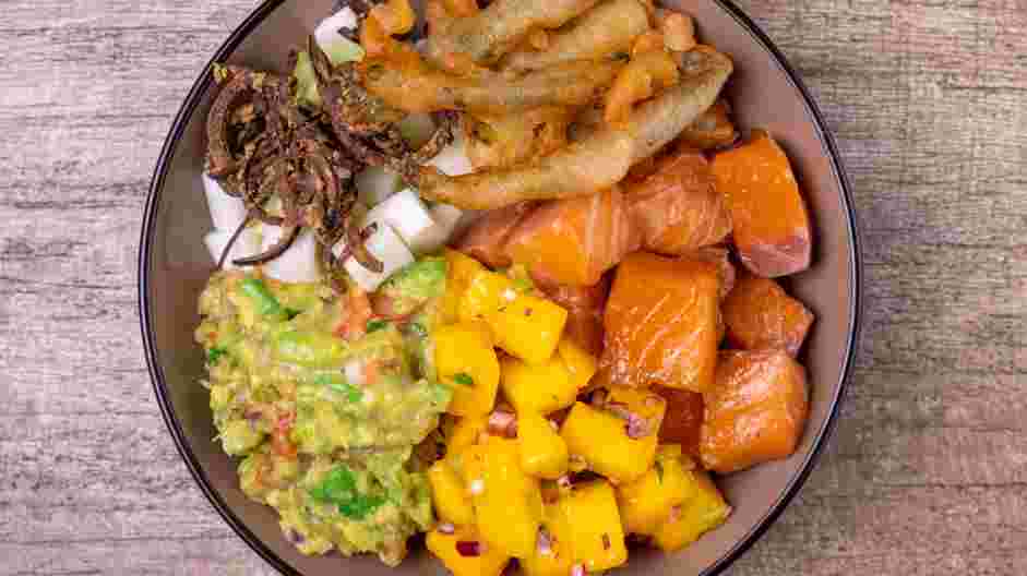 Salmon Poke Bowl Recipe: Place a few asparagus tempura spears on each bowl.