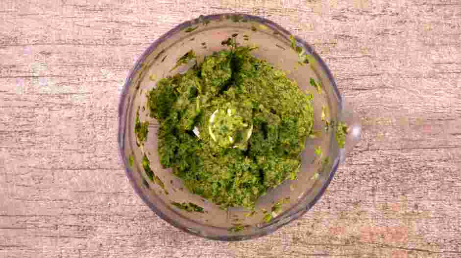 Greek Lamb Meatballs Recipe: In the bowl of a food processor, add the onion, cilantro, parsley and kosher salt.