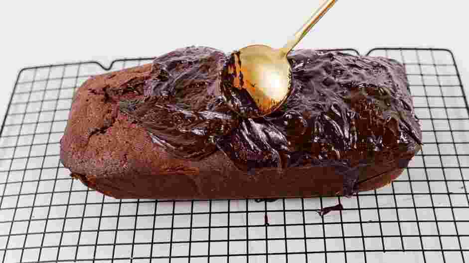 Chocolate Pound Cake Recipe: Once the cake is completely cooled, pour the chocolate ganache on top of the cake and spread it in an even layer.