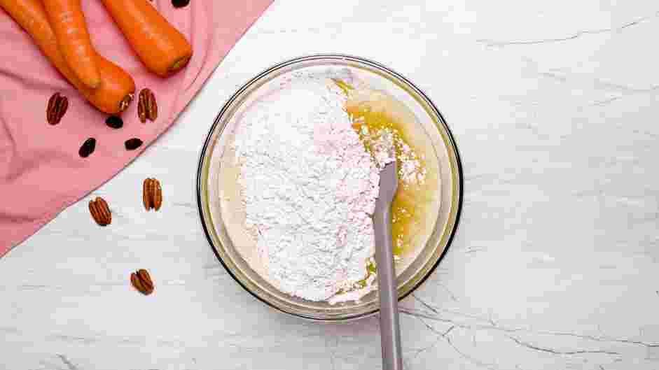 Carrot Cake Bundt Cake Recipe: Fold the dry ingredients into the wet ingredients and blend well.