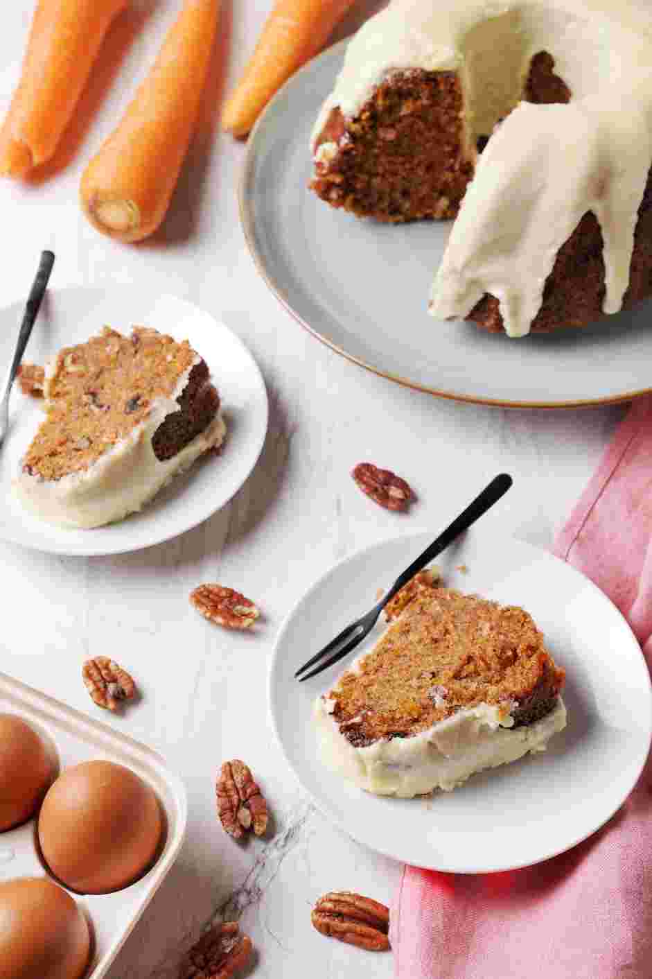 Carrot Cake Bundt Cake Recipe: Drizzle the cream cheese frosting over the cooled carrot cake bundt cake.