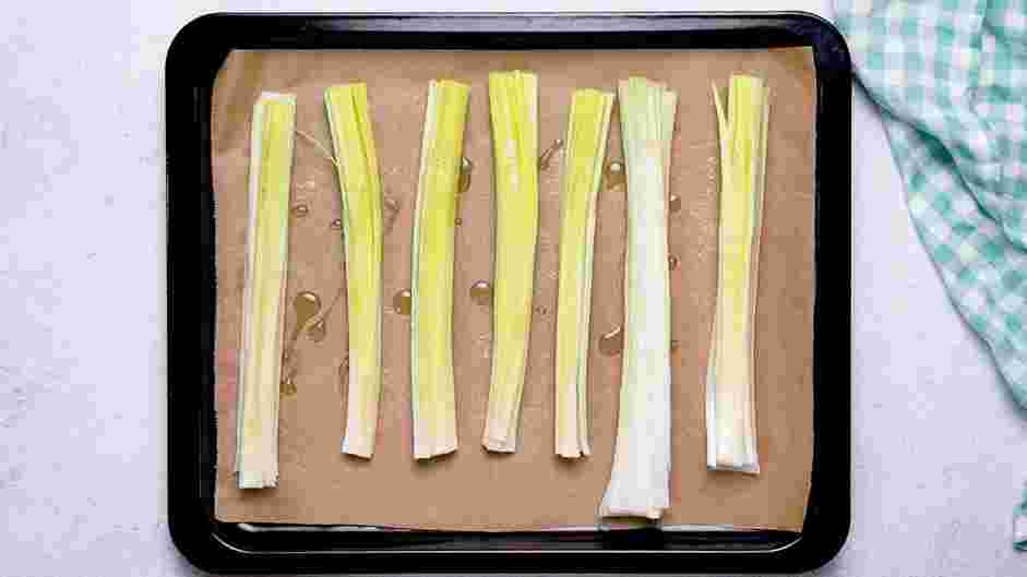 Roasted Leeks Recipe:
Arrange leeks on a parchment-lined sheet tray.