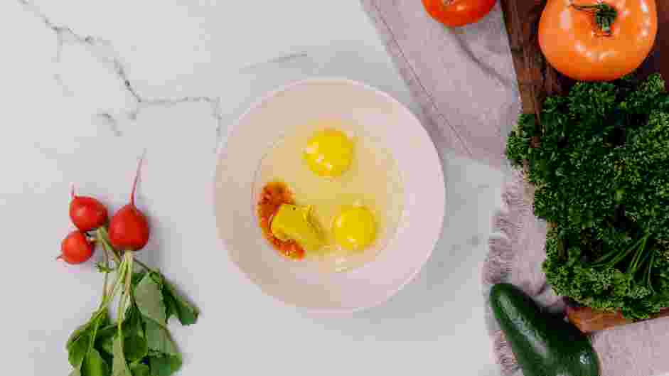 Cornflake Chicken Recipe: In a second shallow bowl, whisk together the eggs, hot sauce and yellow mustard.