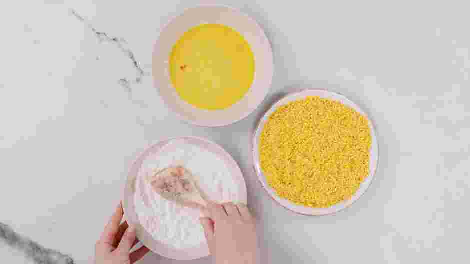 Cornflake Chicken Recipe:
Coat one piece of chicken with the flour and shake off the excess.
