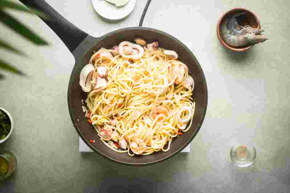 Seafood Linguini Recipe: Turn off the heat and add the reserved pasta to the saucepan.