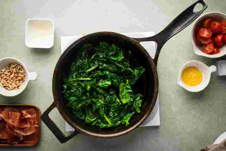 Wilted Spinach Salad Recipe: In a 12-inch skillet over medium heat, heat the olive oil.