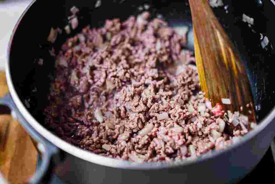 Red Chili Recipe: In a large stockpot over medium-high heat, saut&eacute; the ground beef, onions and garlic until the beef is browned and onions become soft.