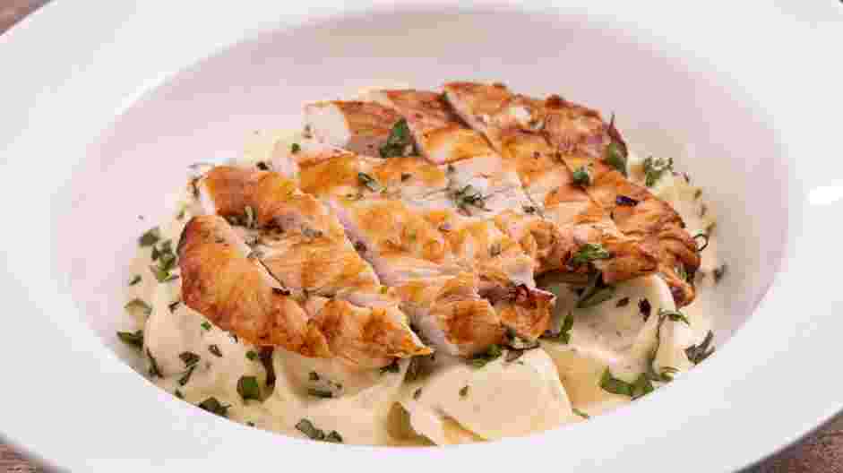 Asiago Tortelloni Alfredo with Grilled Chicken Recipe: Top the pasta with the sliced chicken and drizzle with additional alfredo sauce.